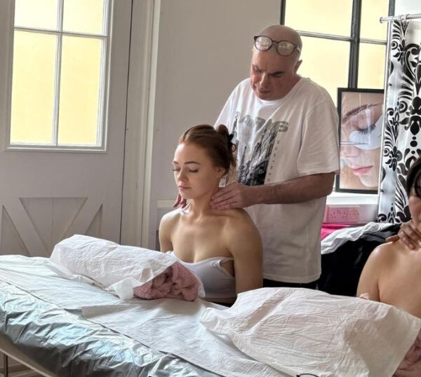 Tutor demonstrating a shoulder massage