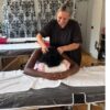 Tutor demonstrating Indian head massage