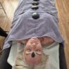 Hot stones placed along a client's back