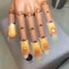 UV gel nail extensions on a practice hand