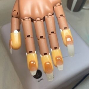 UV gel nail extensions on a practice hand