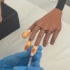 UV gel nail extensions on a practice hand