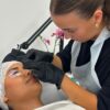 Student tinting lashes during a lash lift