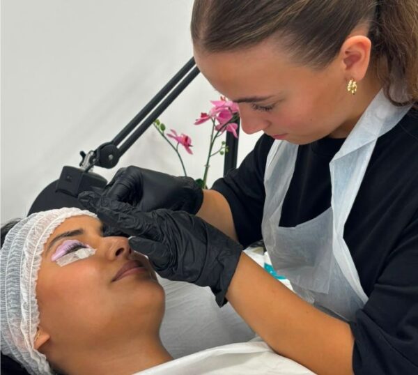 Student tinting lashes during a lash lift