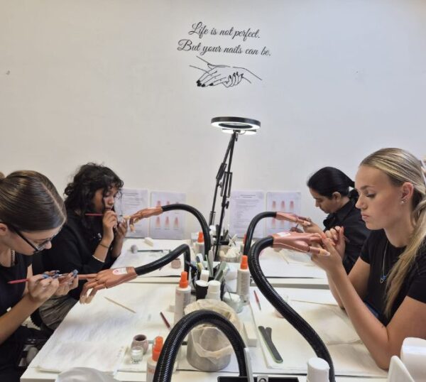 Students practising acrylic nails at the Acrylic Nail Extensions Training Course