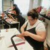 Students practising nail extensions in class