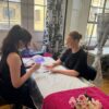 Students practising gel nails in a training room