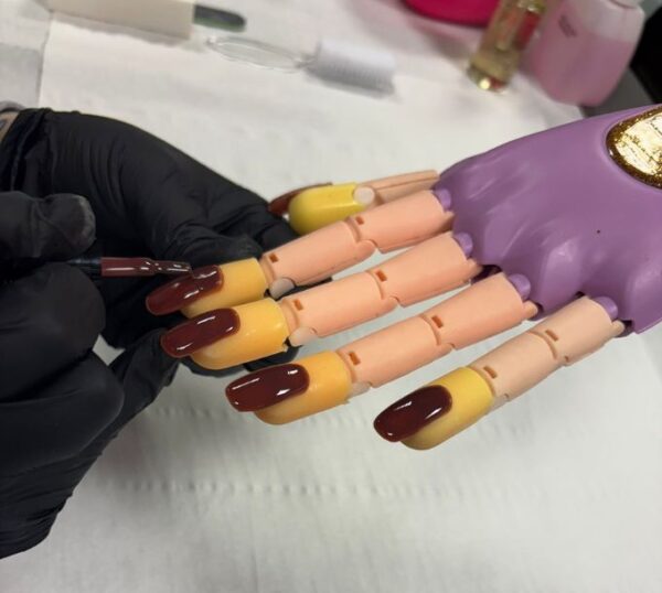 Gel polish nails on a practice hand