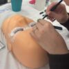 Lash extensions being applied to a practice mannequin