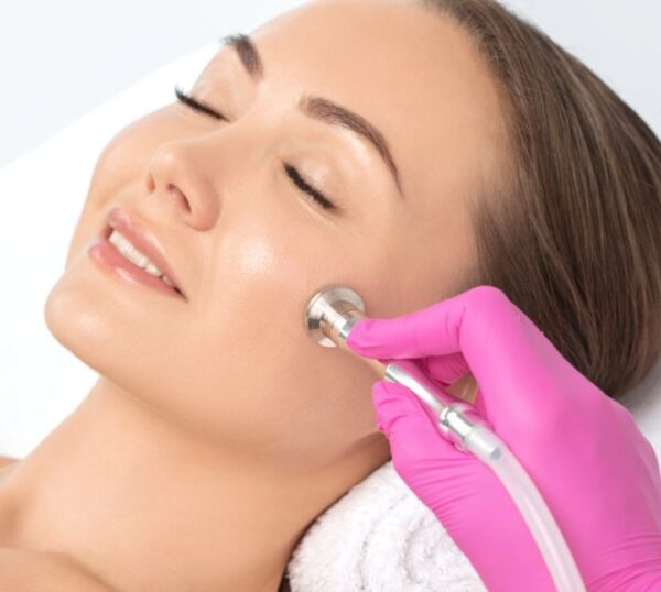 Client receiving a microdermabrasion facial