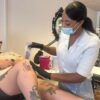 Student carrying out a waxing treatment