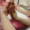 Reflexology foot treatment in a training room