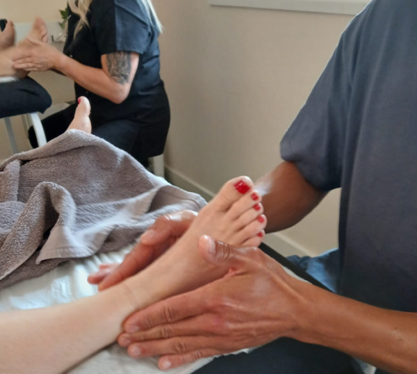 Reflexology foot treatment during training
