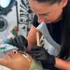 Student carrying out a lash lift treatment