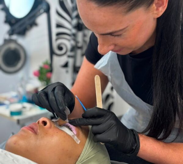 Student carrying out a lash lift treatment