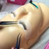 Russian volume lashes being applied to a training mannequin