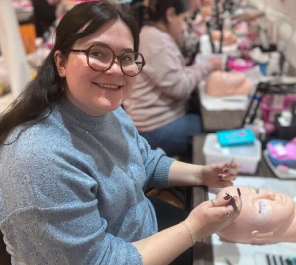 Smiling student during a lash training course