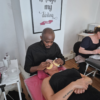 Student practising lash extensions on a mannequin head