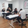 Students practising nails in a Beauty Academy training room