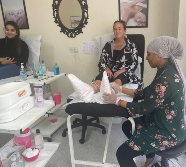 Students practising pedicures during training