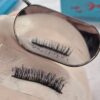 Lash extension fan held on a mirror