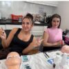 Smiling lash students during training
