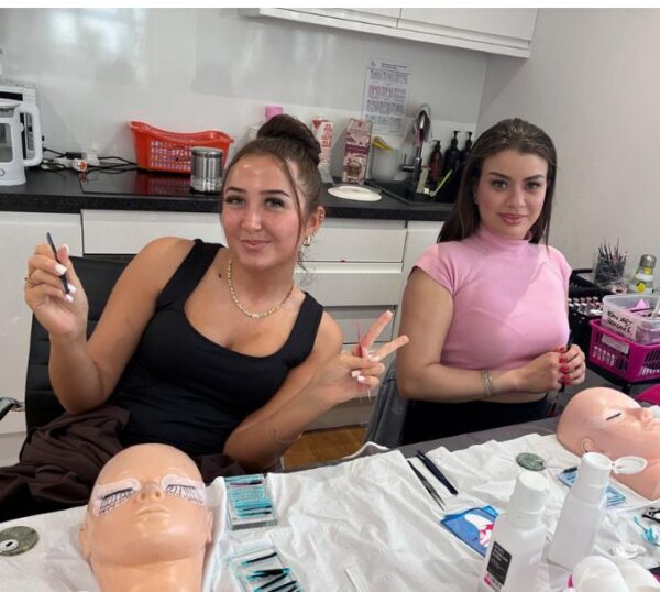 Smiling lash students during training