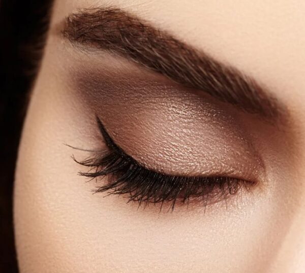 Close-up of a groomed brow and eyeshadow