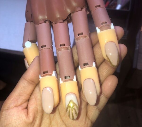 Builder gel nails on a practice hand