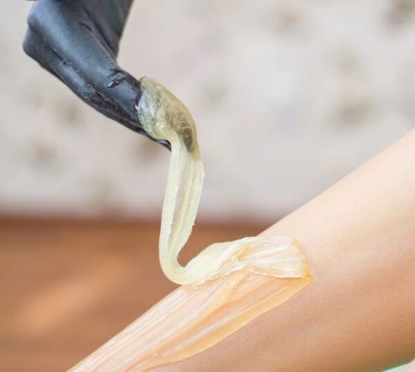 Sugaring paste being applied for hair removal