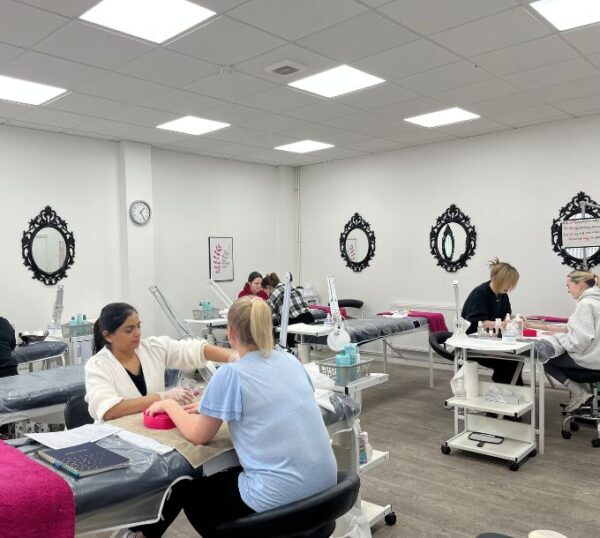 Beauty Academy training room with manicure stations