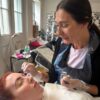 Tutor demonstrating a brow treatment