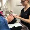 Student giving a facial massage