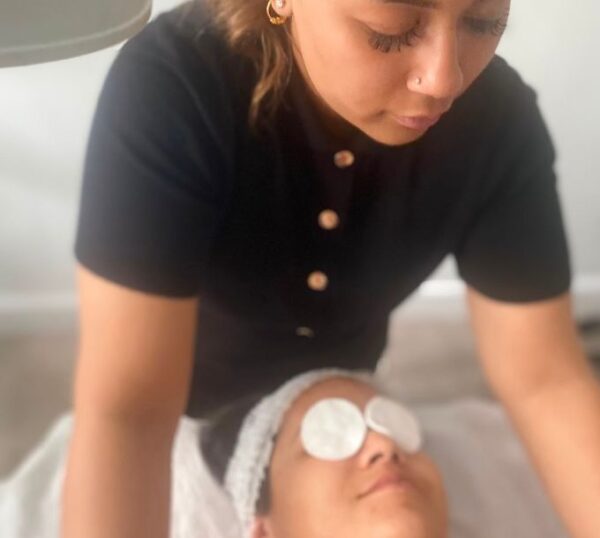 Student giving a facial massage