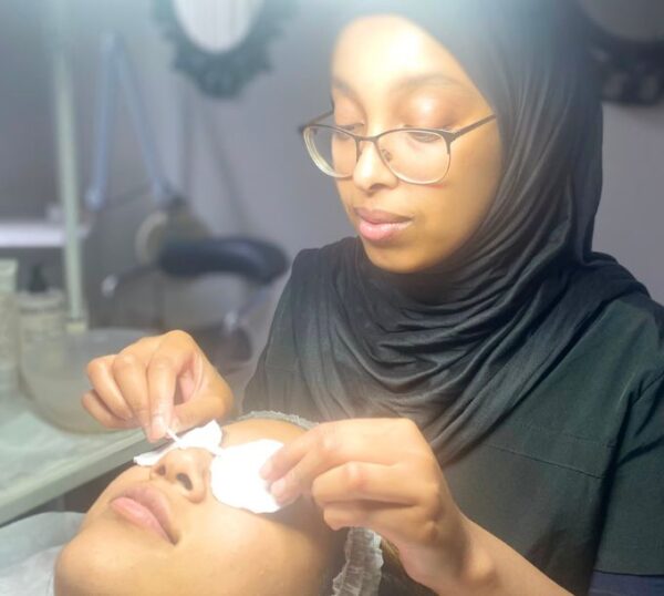 Student practising a skincare treatment
