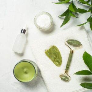 Jade facial roller, gua sha and skincare products