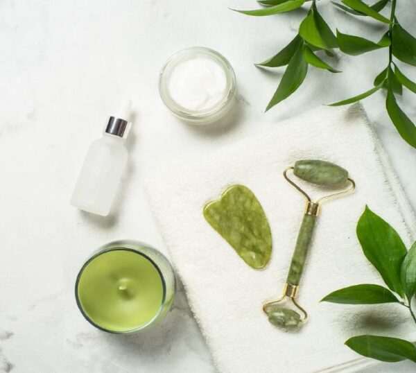 Jade facial roller, gua sha and skincare products