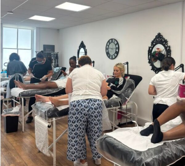 Waxing training class in progress at The Beauty Academy
