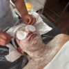 Client receiving a facial mask treatment