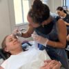 Student shaping a model's brows during training