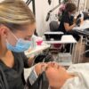 Student carrying out an electrical facial in training