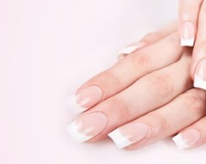 Natural acrylic nail extensions with a French finish