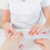 Nail technician giving a manicure
