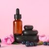 Aroma massage stones and an essential oil bottle