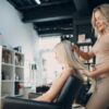 Hair technician styling a client's hair in a salon