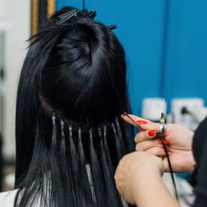 Nano ring hair extensions being fitted