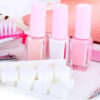 Pink manicure tools and nail polishes
