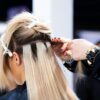 Tape hair extensions being fitted