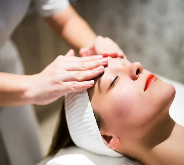 Client receiving a relaxing facial massage