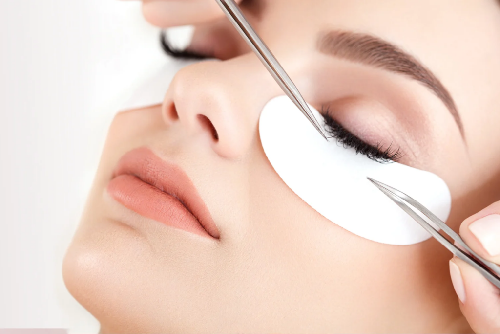 Lash technician applying eyelash extensions